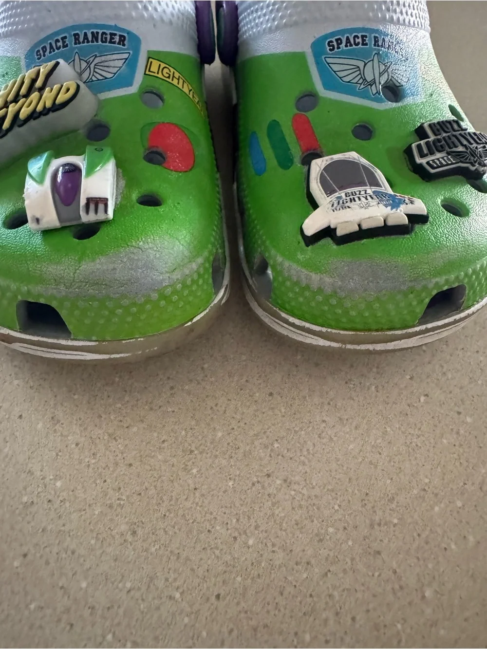 CROCS Kids Green Clogs with Purple Heel Strap and Space Charms